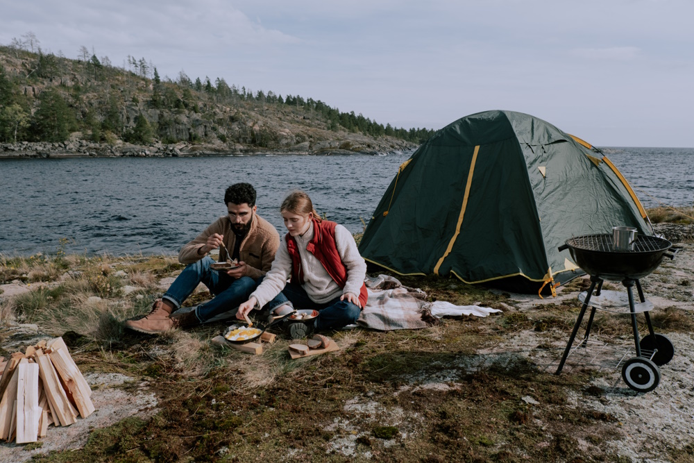 Couple having a camp fire