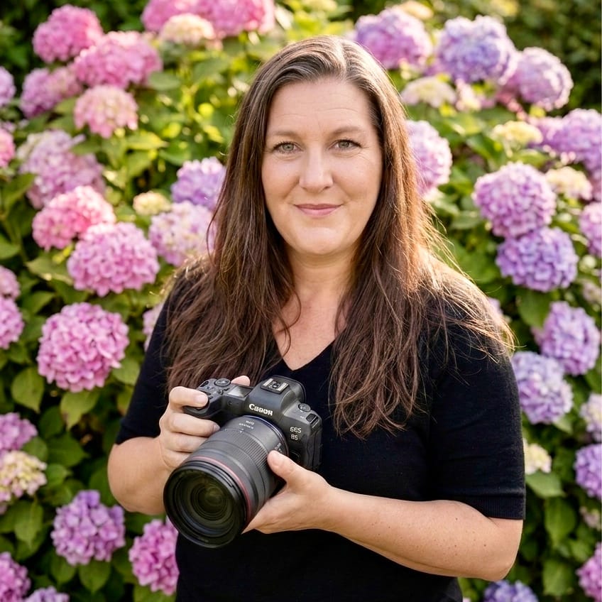 Lesley Notton, a professional Shropshire dog photographer in Shropshire, holding her camera during a Project Dog session in Telford.