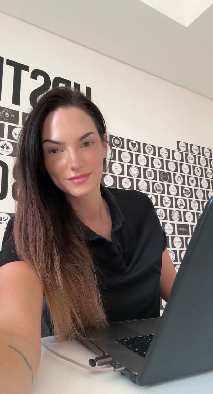 Anne smiling at desk