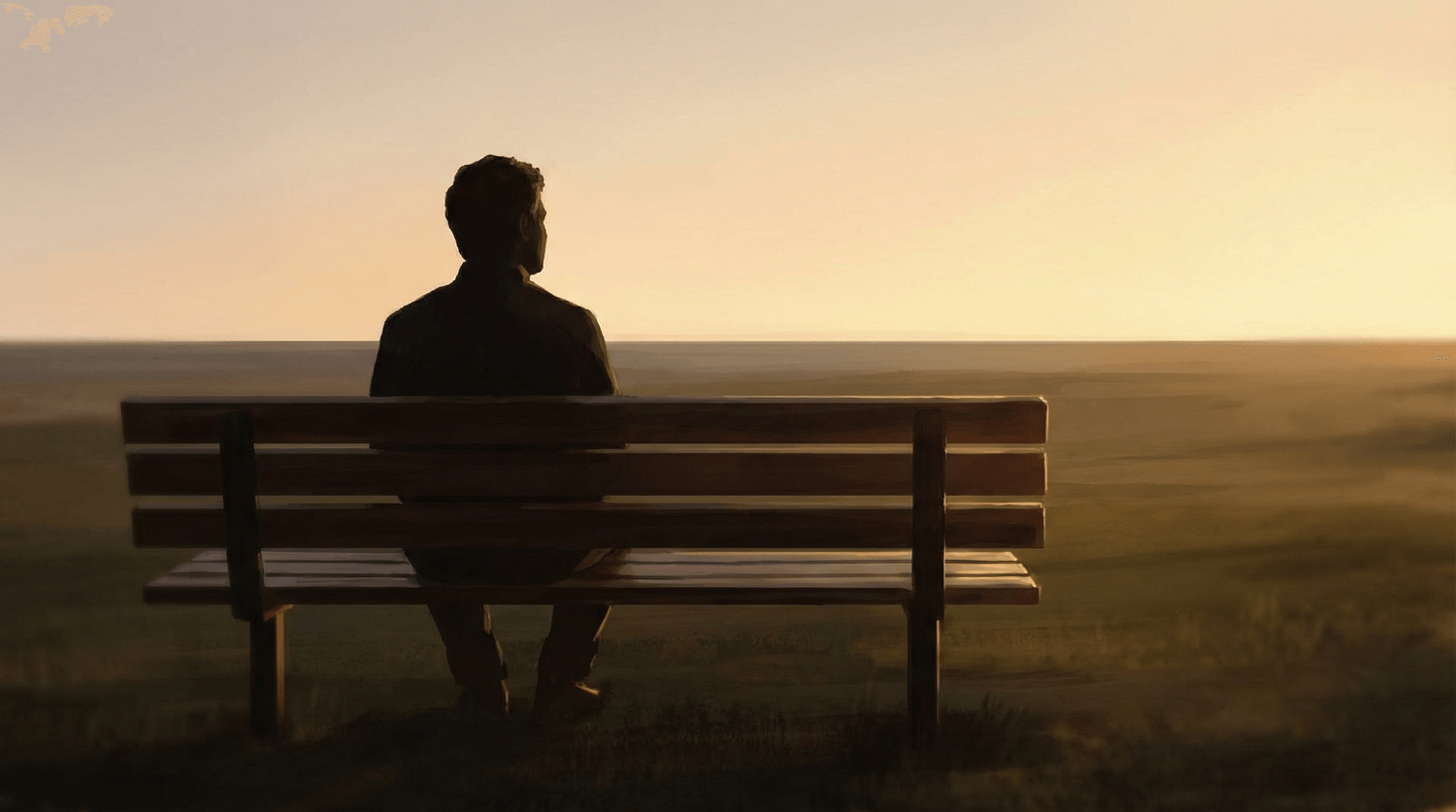 Une personne assise sur un banc observe un paysage au crépuscule, moment de pause intérieure et de reconnexion à soi.