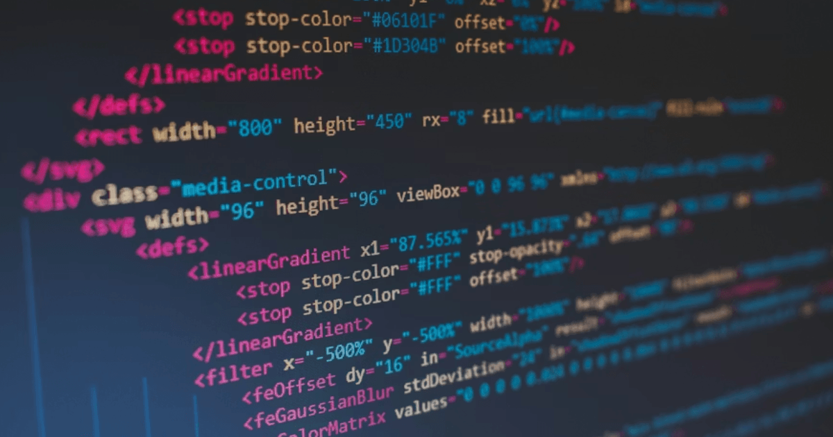 Smiling child completing a coding project