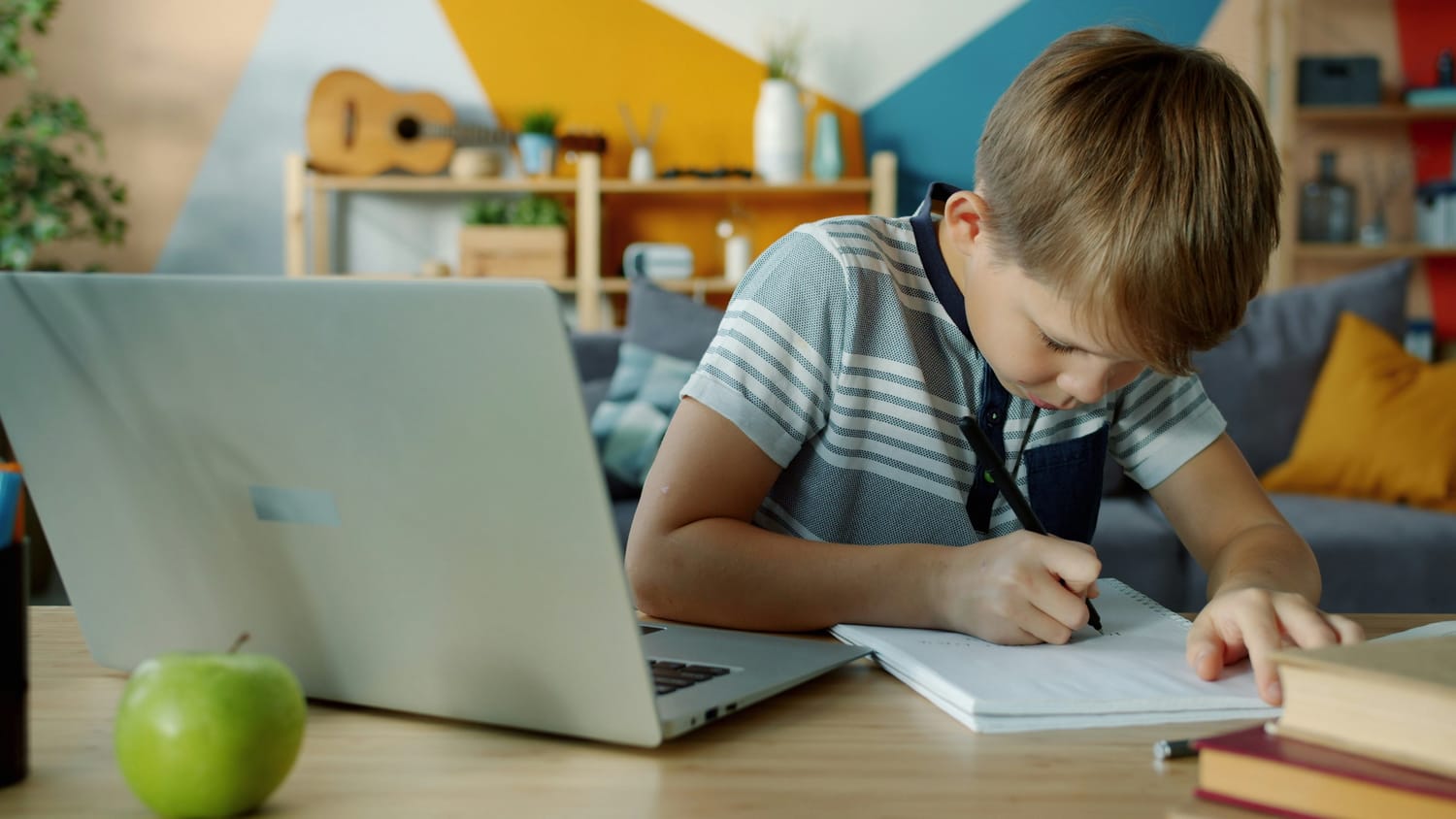 Child focused on a coding problem — growth mindset