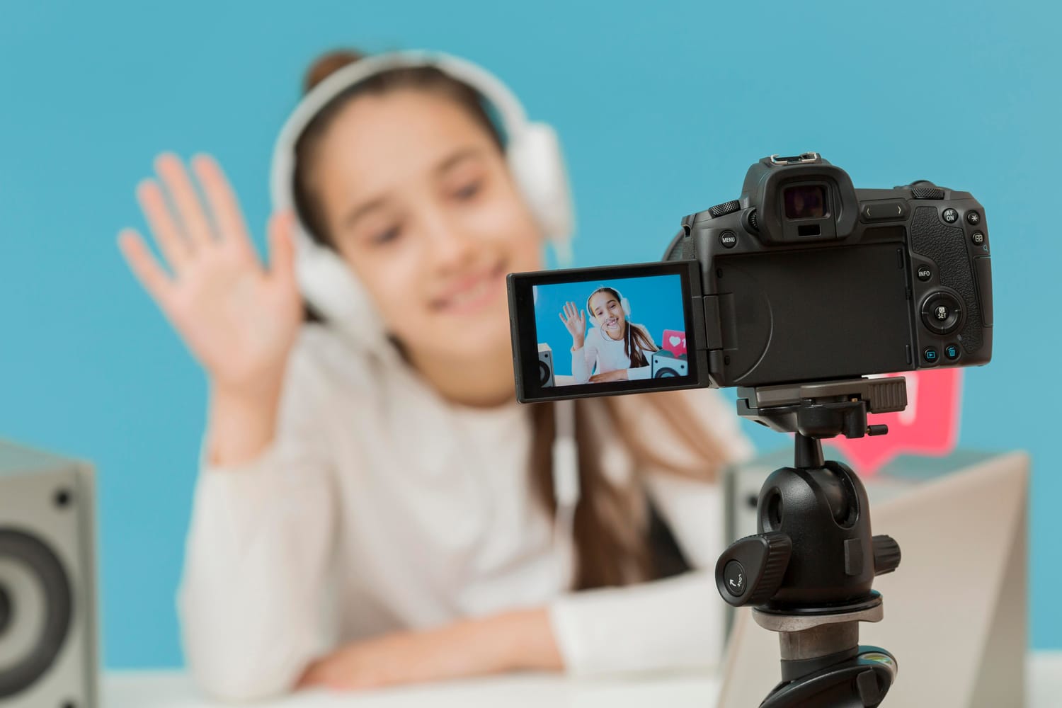 Child recording video on a camera representing a youtube channel