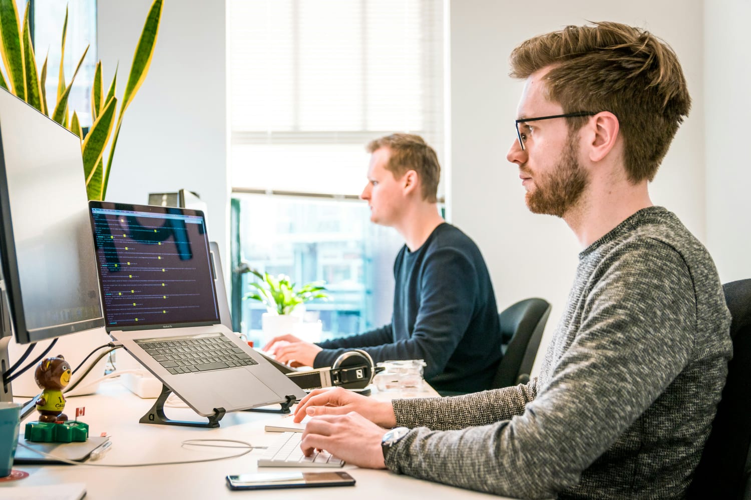A team of professionals collaborating on cloud-based software