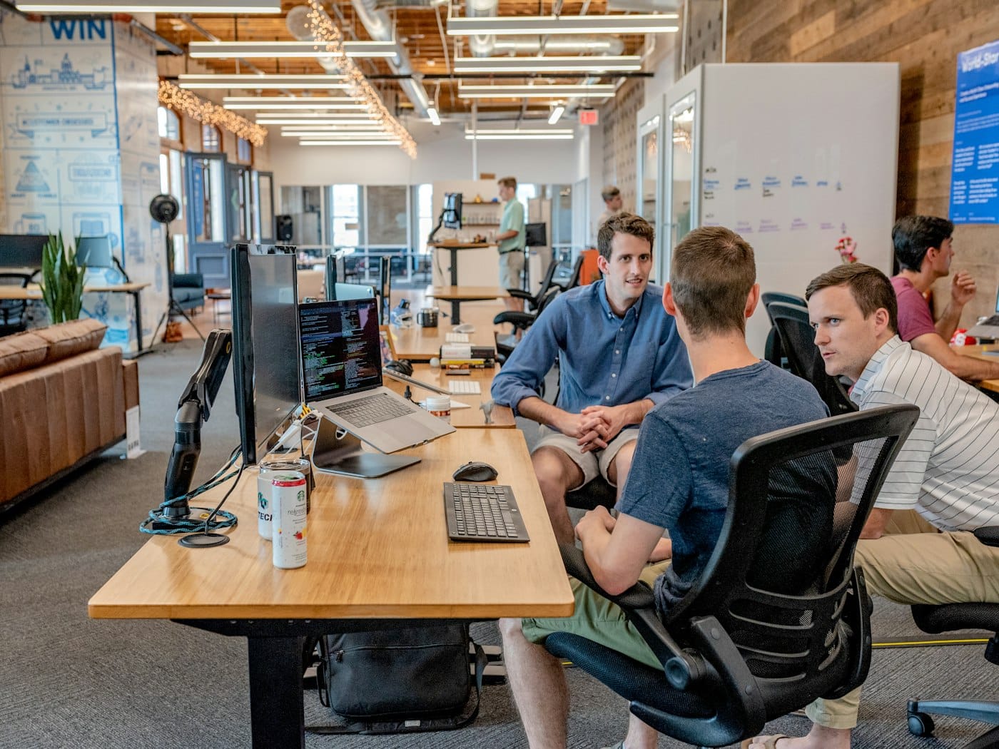 Senior professionals in a glass-walled meeting room