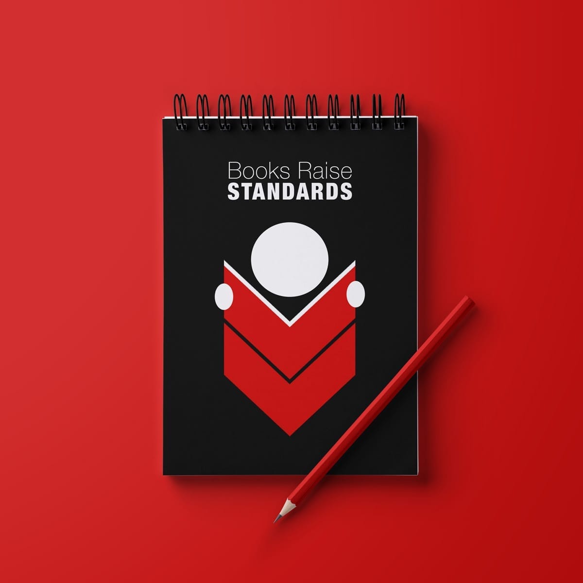 Black spiral-bound notebook displaying Books Raise Standards campaign branding