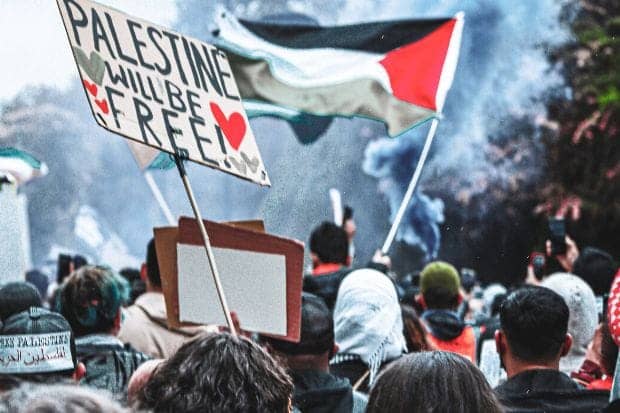 People Holding Flags