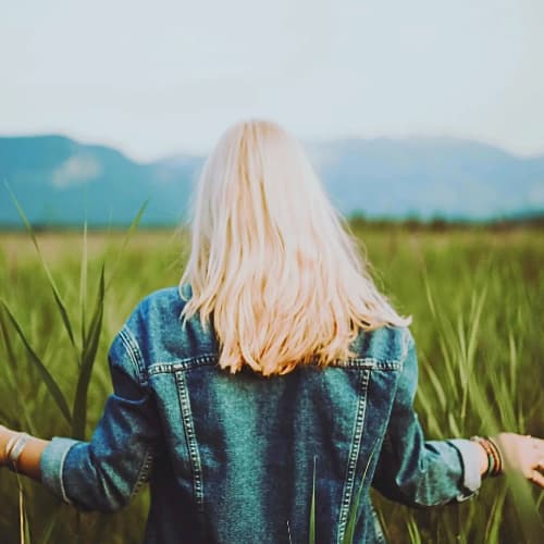 Woman Standing on Crop Field