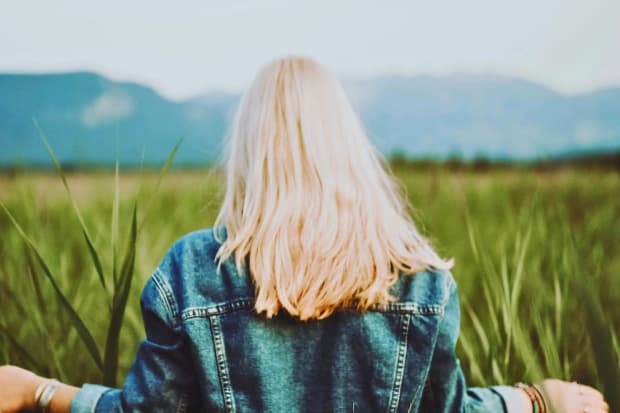 Woman Standing on Crop Field
