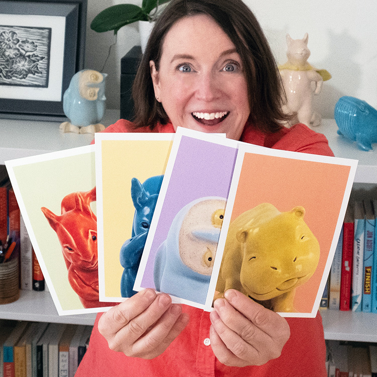 Cheryl B Hutchinson holding 4 prints from Swinging Moods Collection