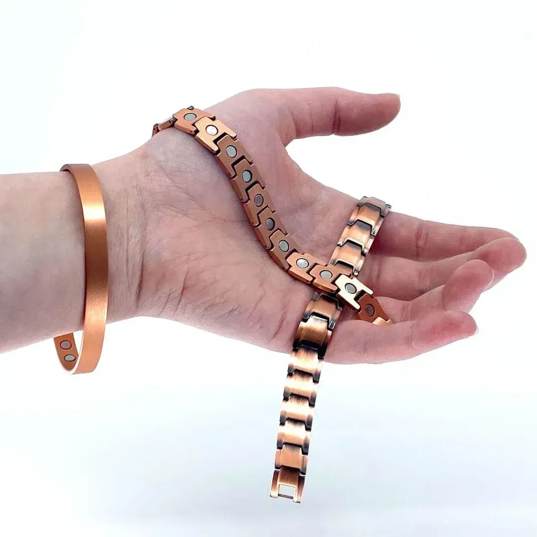 Hand displaying 3 bracelets pure copper magnetic