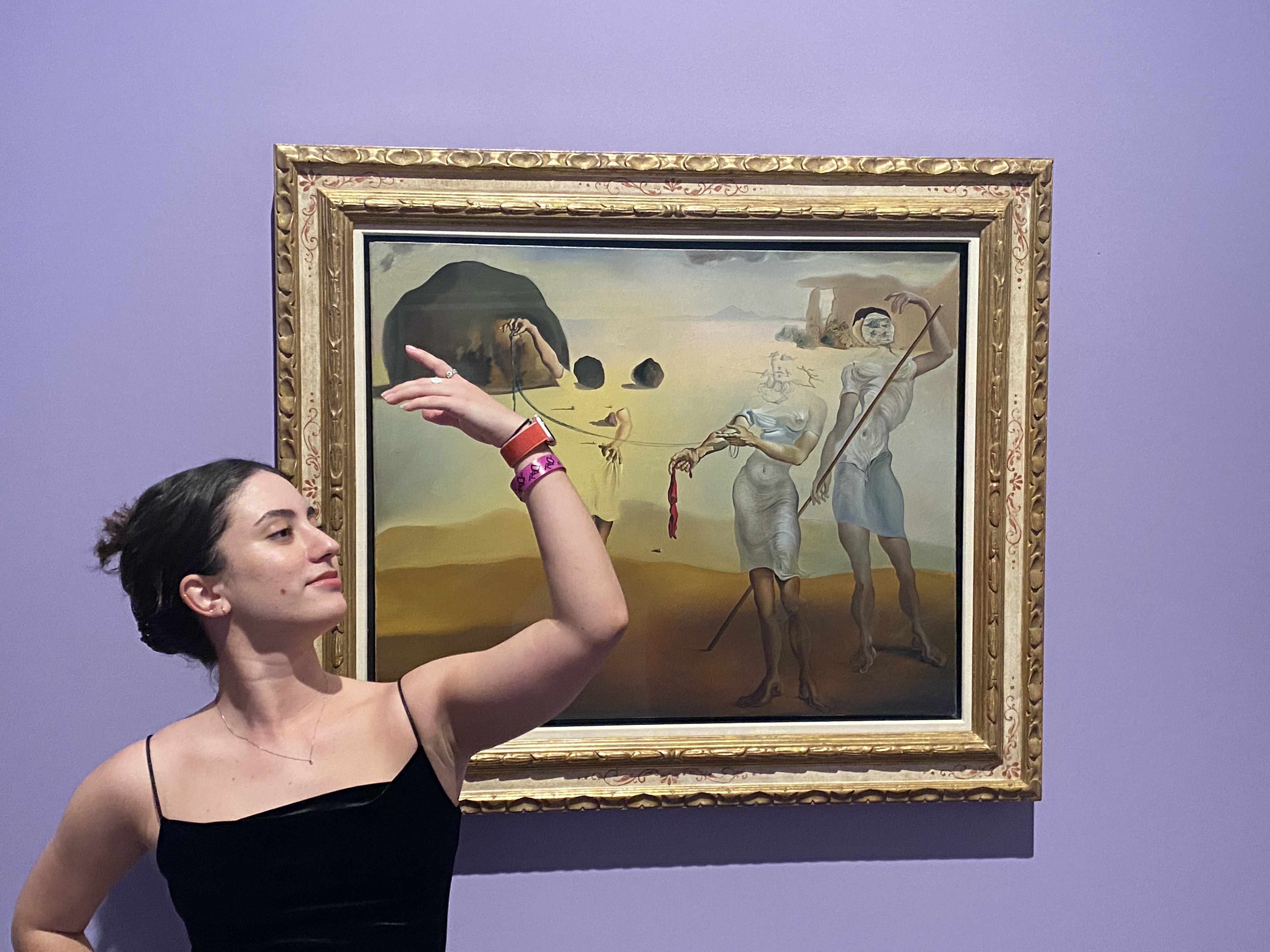Co-performance Thaís posing with the Dalí painting that inspired our dance | The Orthodox Snake Writing Agency