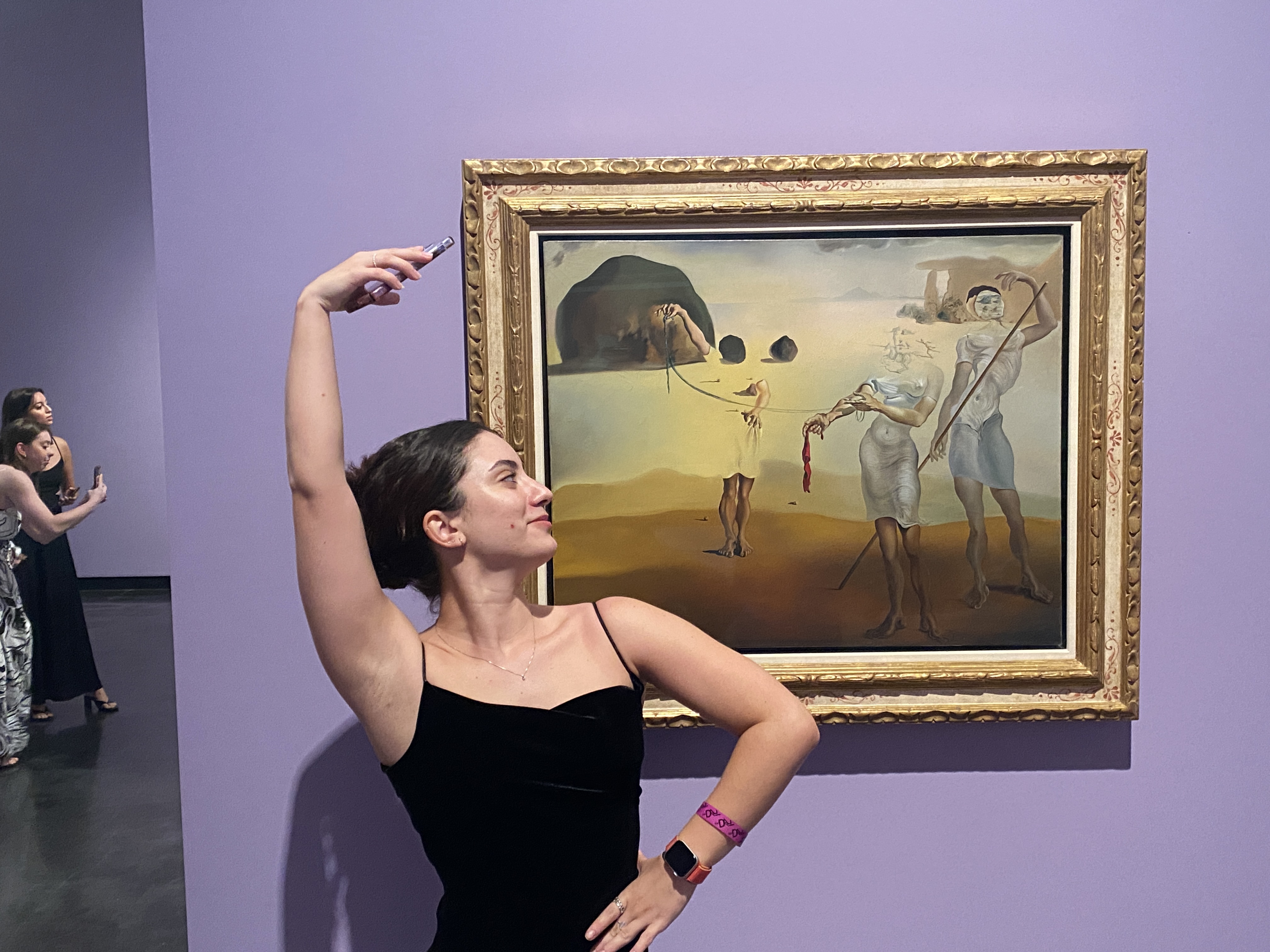 2nd photo of co-performer Thaís posing with the Dalí painting that inspired our dance | The Orthodox Snake Writing Agency