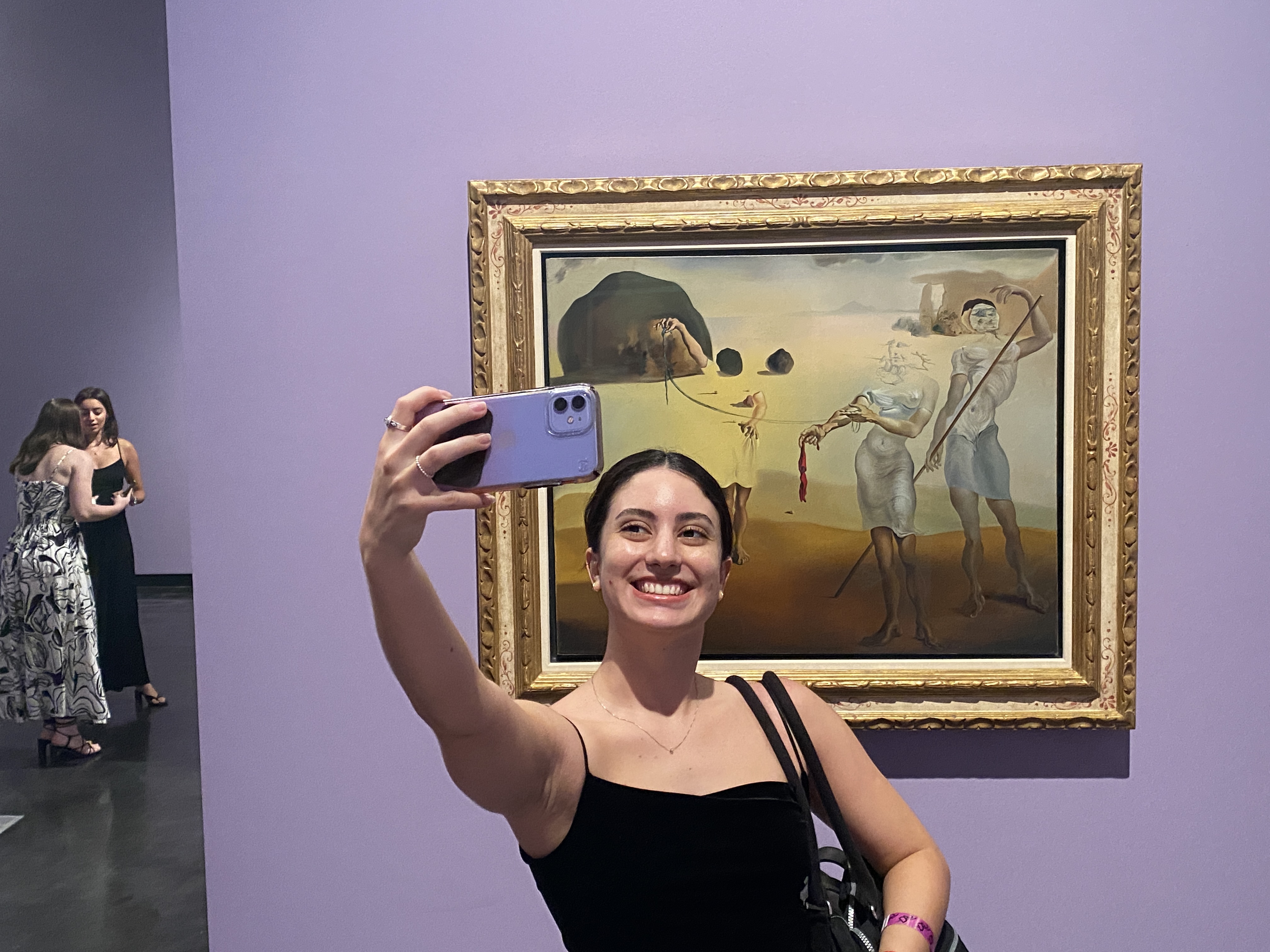 Co-performer Thaís taking a selfie with the Dalí painting that inspired our dance | The Orthodox Snake Writing Agency