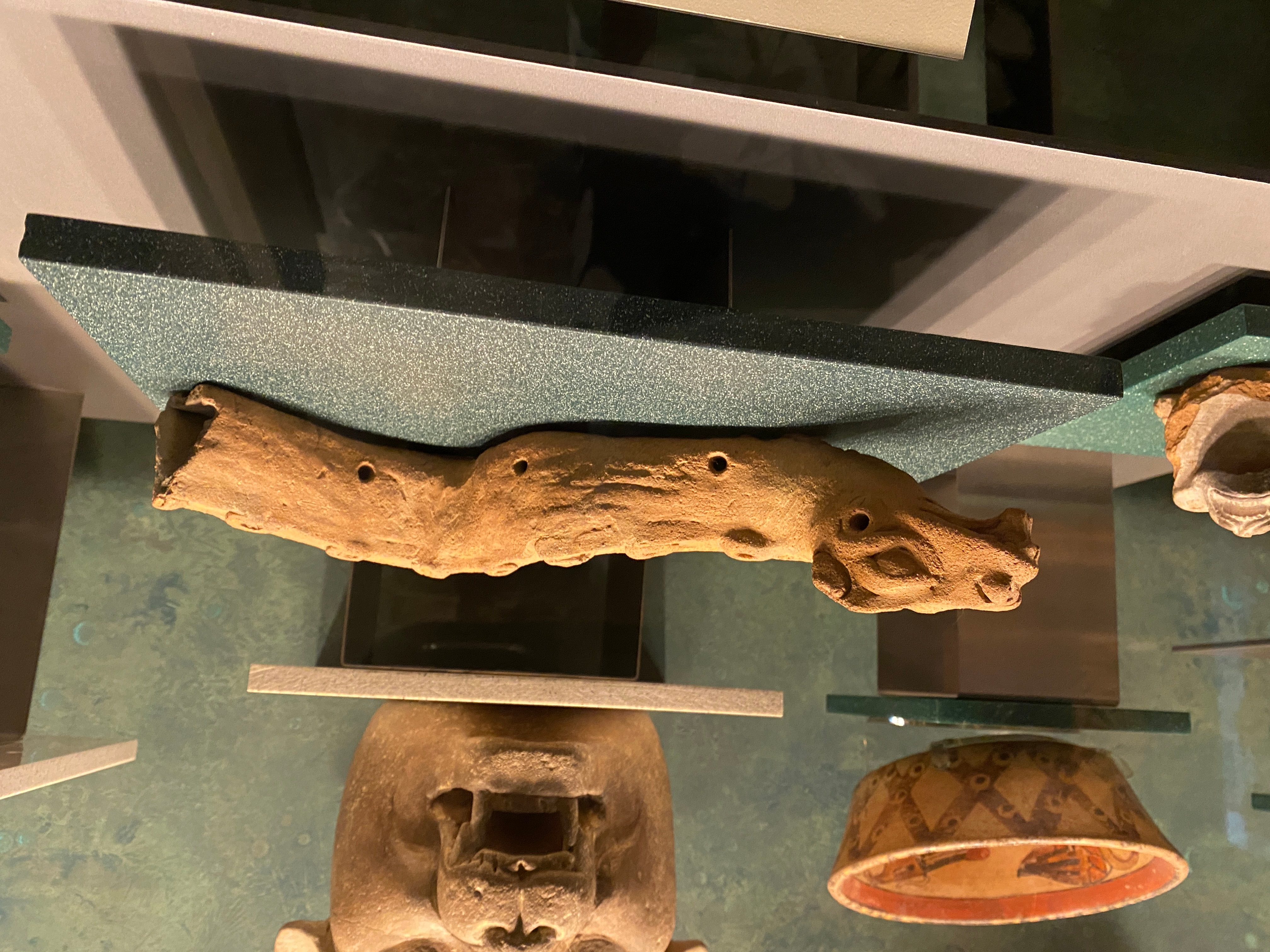 A snake carved out of a wooden branch | The Orthodox Snake Writing Agency