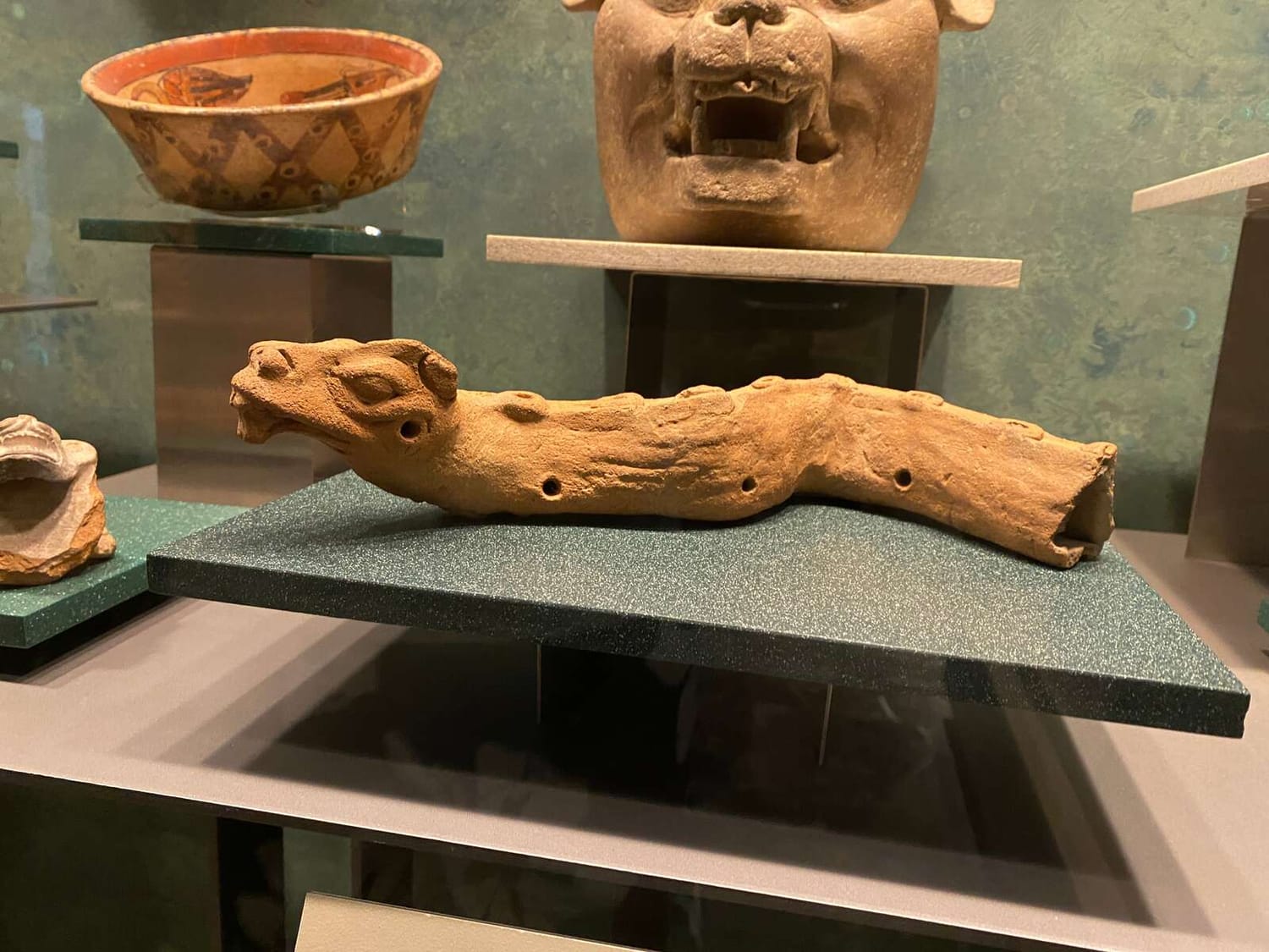 A snake carved out of a wooden branch | The Orthodox Snake Writing Agency