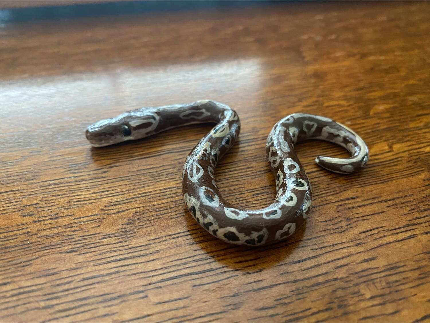 Clay Figurine of Tiffany, made by Spirit Keeper Animal Sanctuary caretakers | The Orthodox Snake Writing Agency