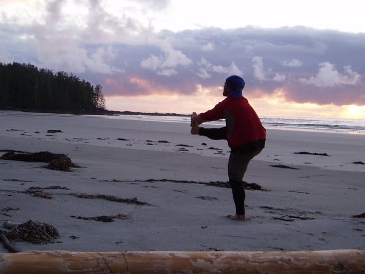 Jarret practicing on the beach in a red shirt.