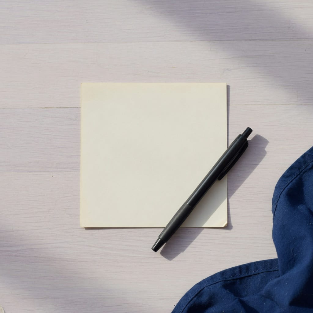 A blank card and a pen, the audit before the advice.