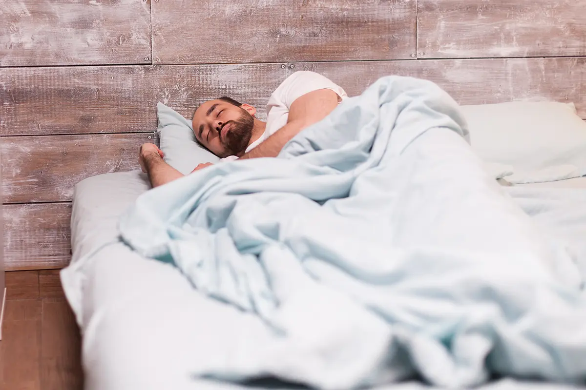 Hypnotized man sleeping in bed