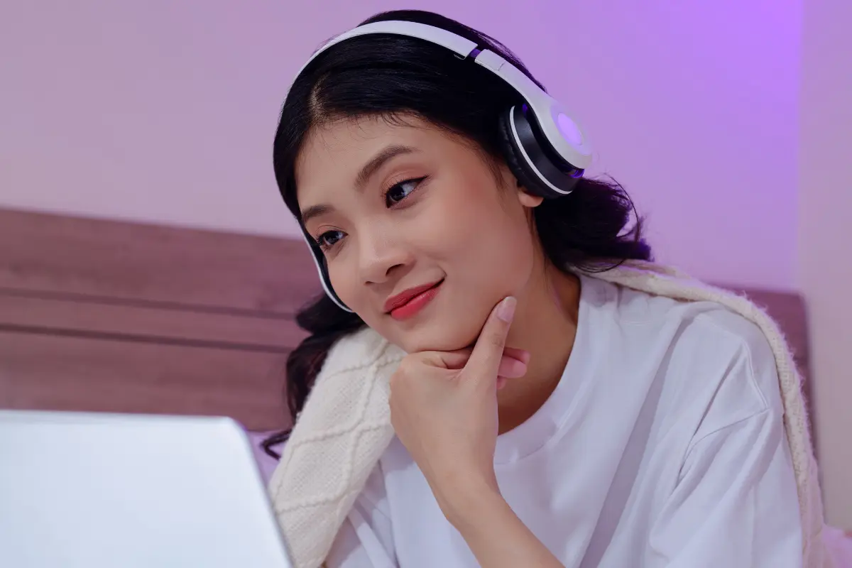 Woman watching video on laptop