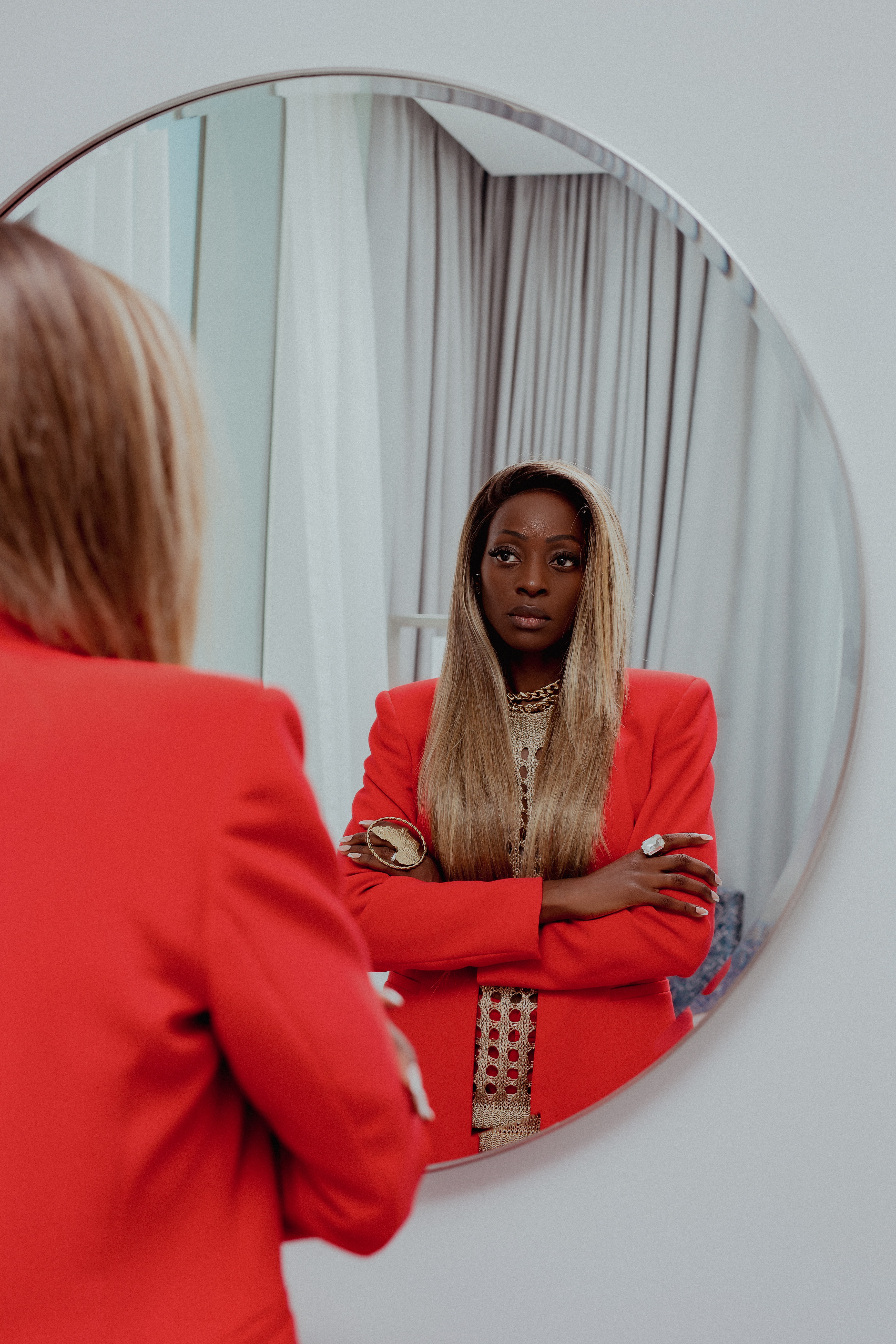 A person looking in a mirror, representing self-reflection and self-awareness.