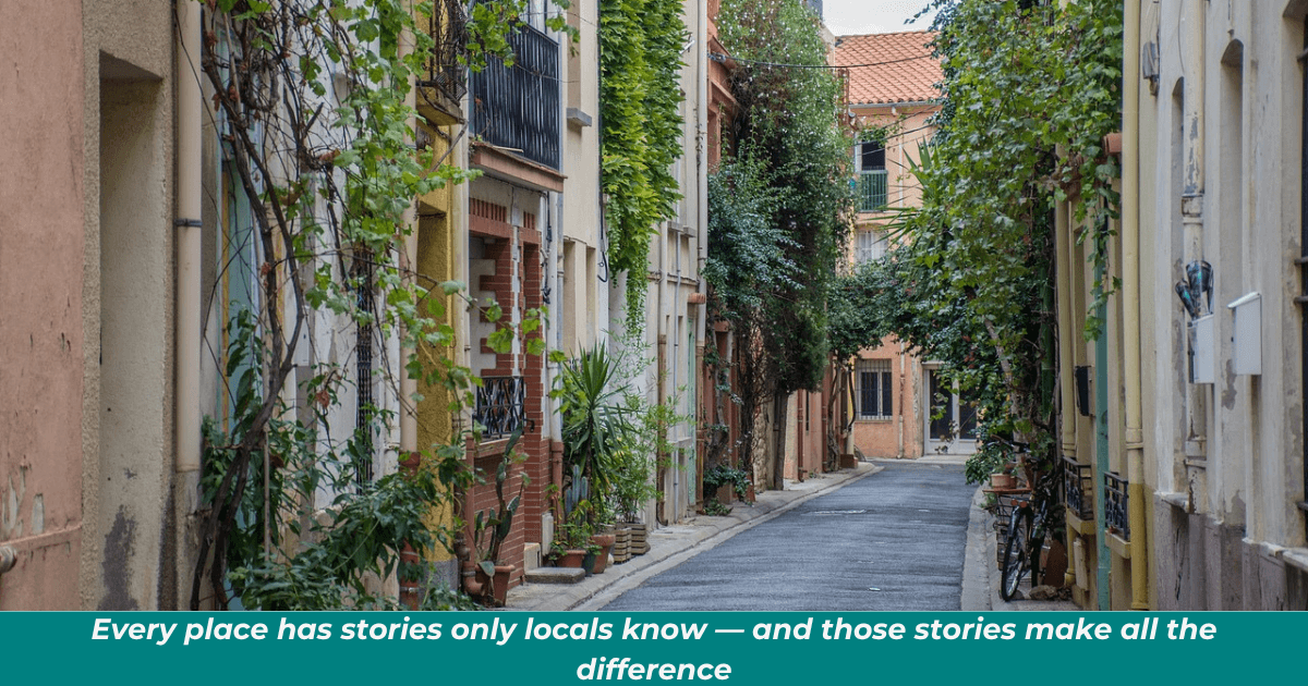 charming town scene of what looks to be an Italian street with homes on either side.