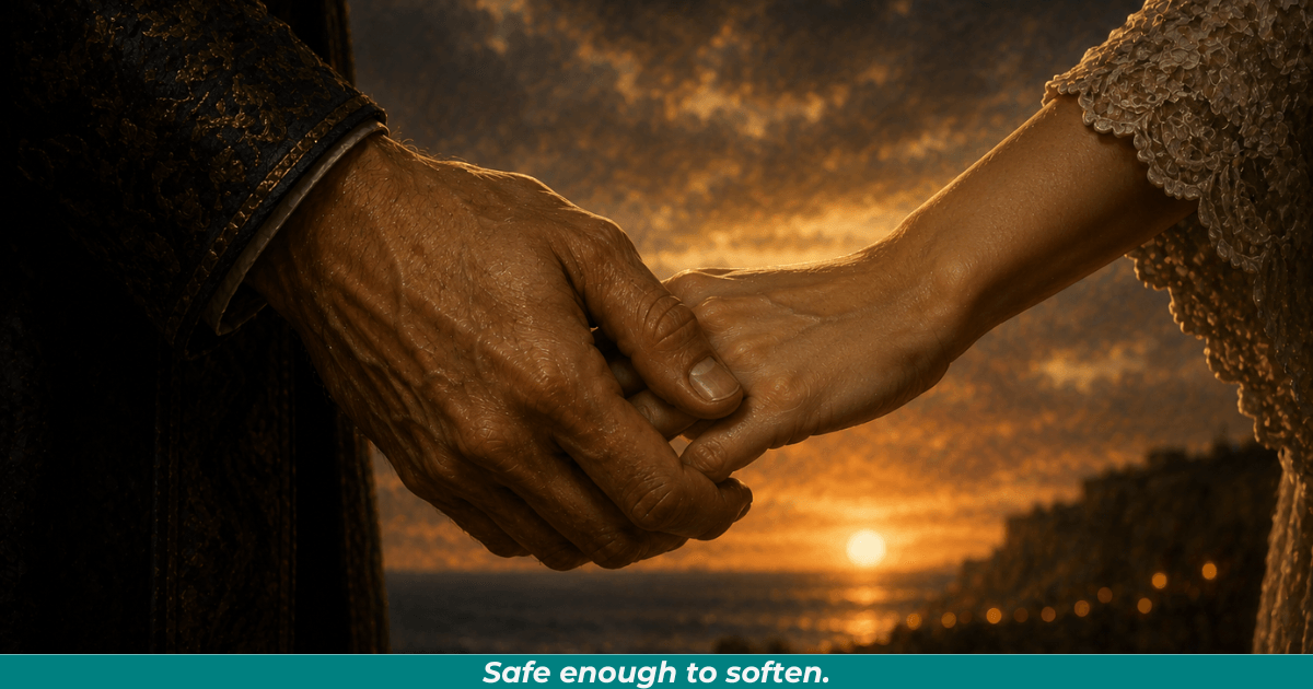 Man holding woman’s hand with a sunset in the background