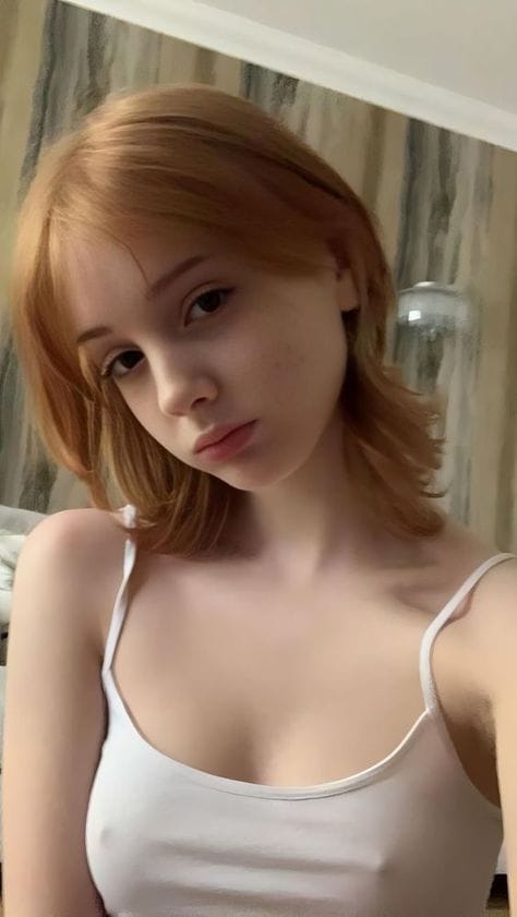 Beautiful hot sexy girl in white camisole pipples protruding small cleavage pink lips blonde hair mideum sized breast