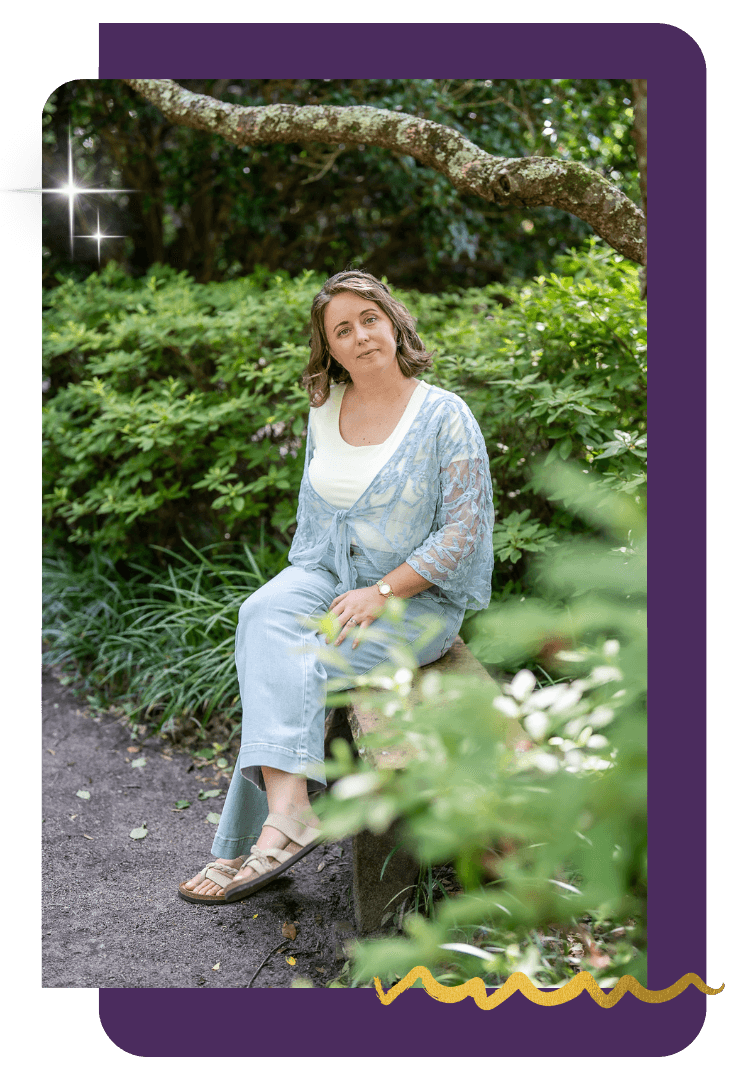 Chelsea Fournier, intuitive business strategist, sitting at a garden