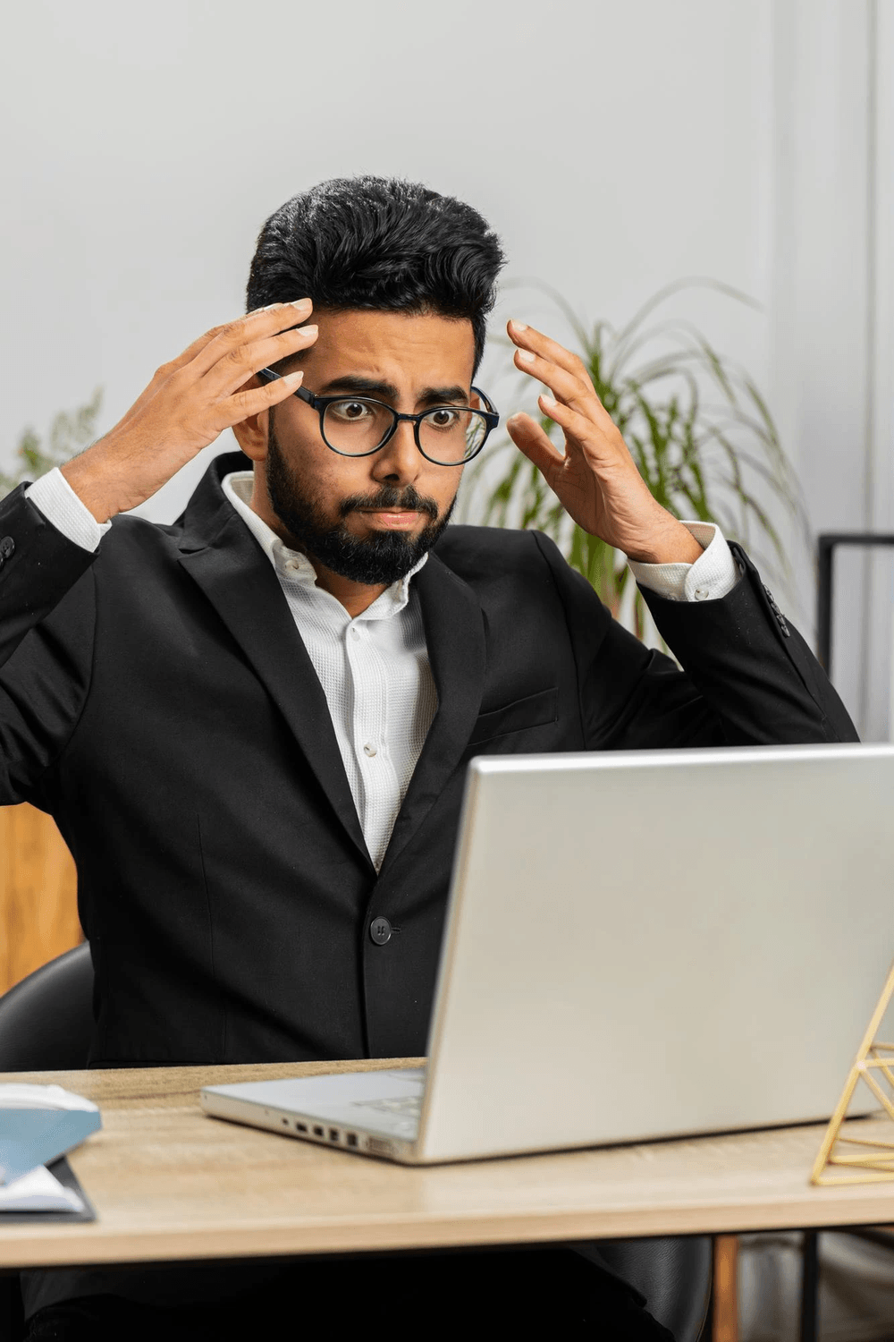 Confused person with laptop
