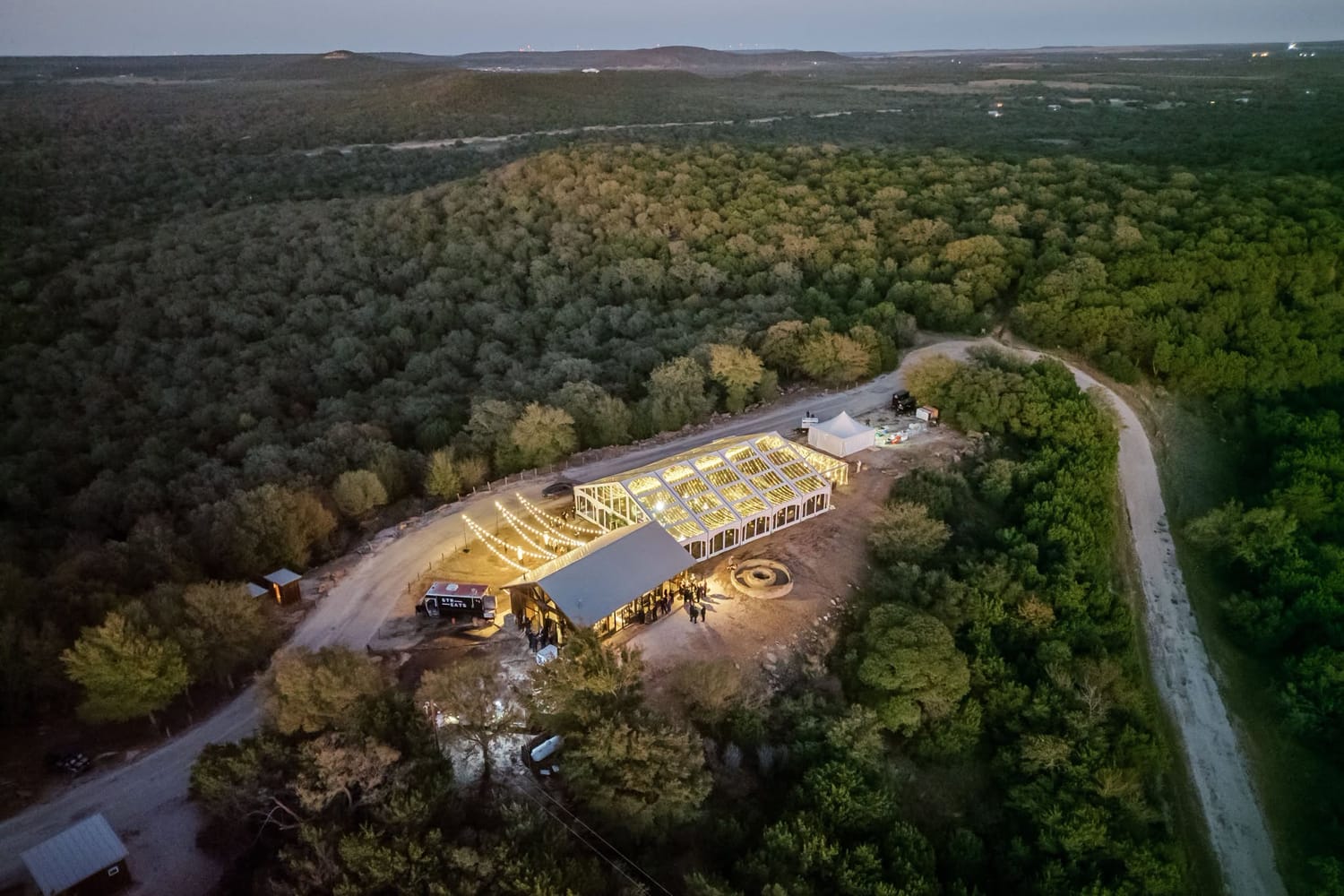 Aerial view of an evening gathering on the ranch