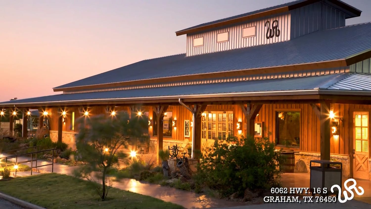 Main lodge lit up at dusk