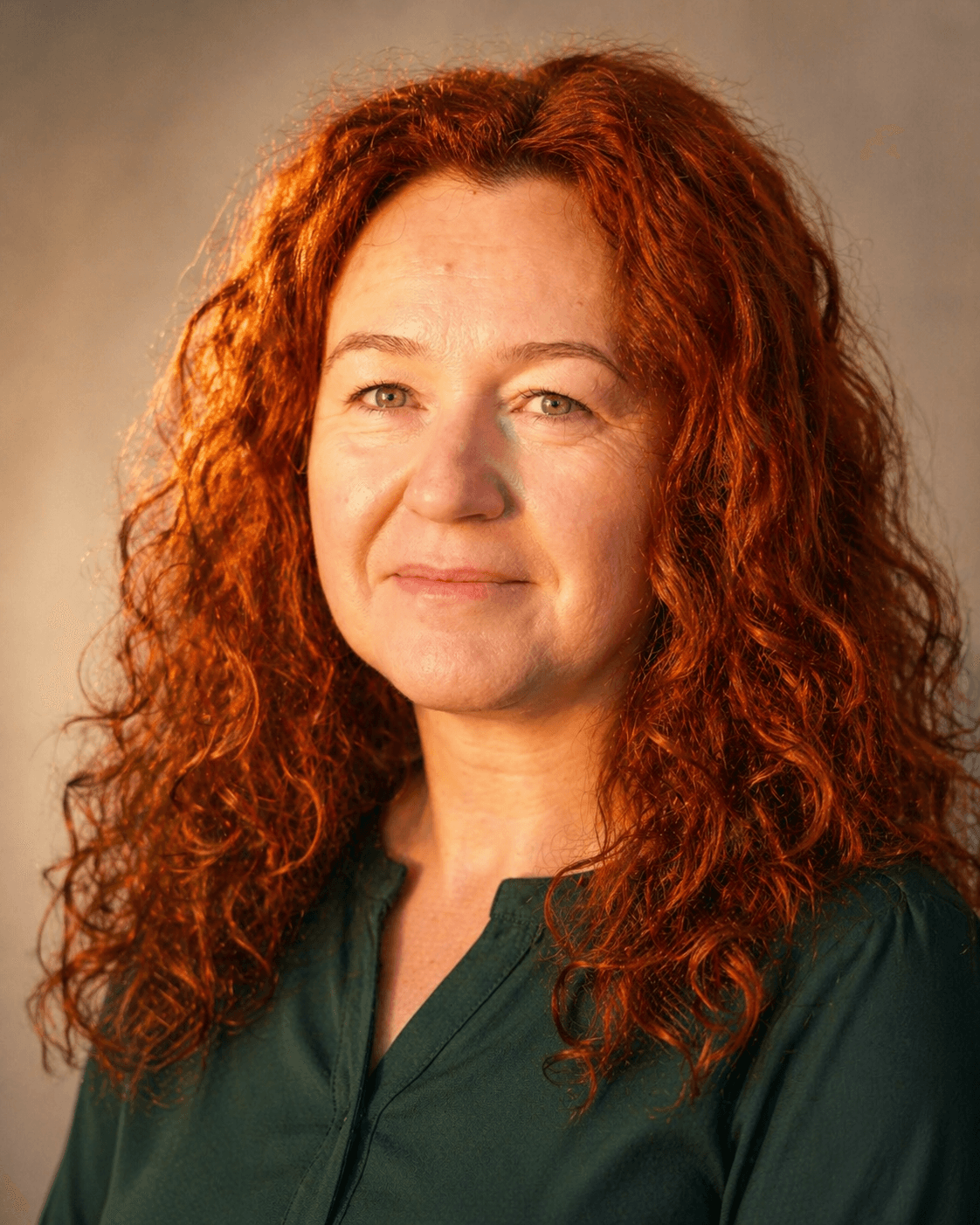 professional portrait of a calm confident woman, warm natural light, wellness mentor