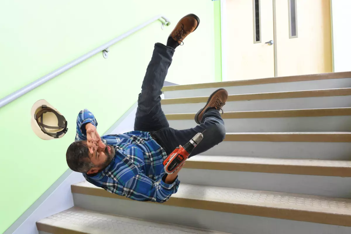 man falling down stairs