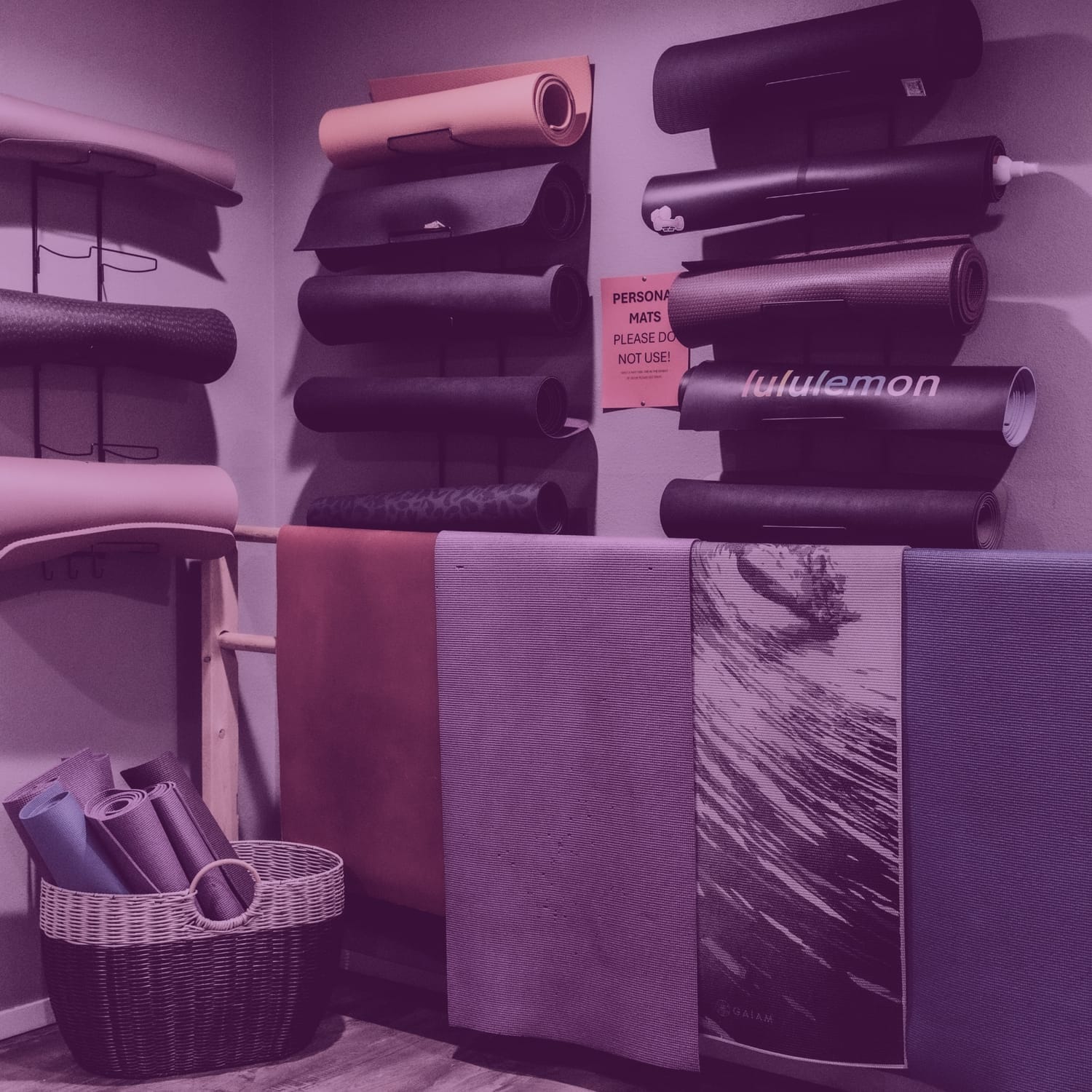 Shelves filled with yoga blocks, bolsters, and other props in Crystallyn Kay’s Studio