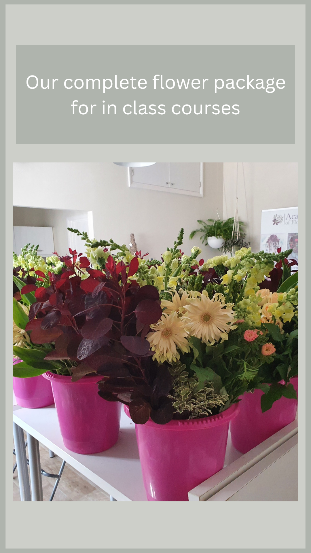 Buckets of cream and burgundy flowers in the Academy classroom