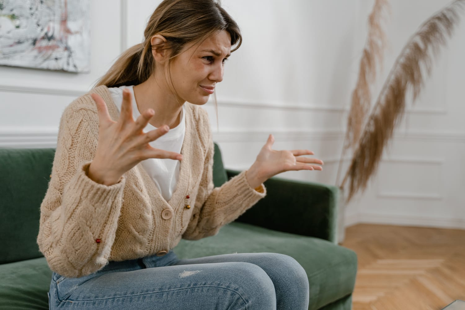 Frustrated dog owner sitting on couch