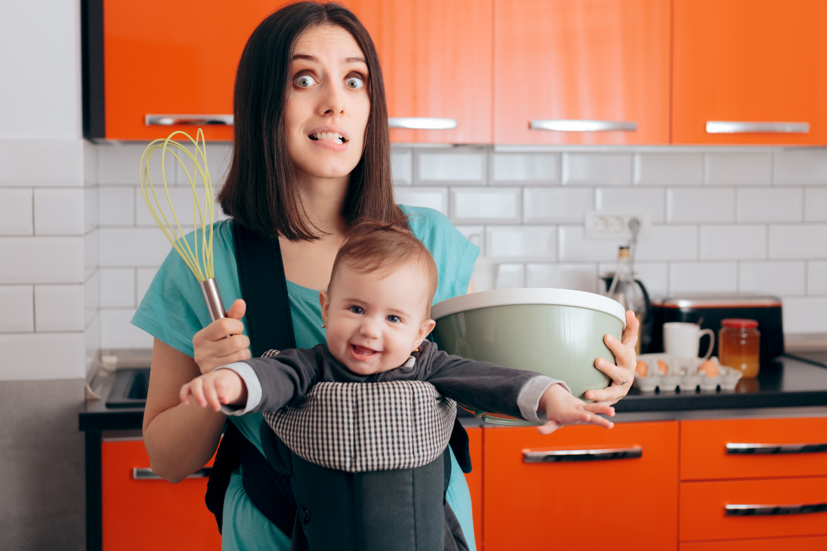 mom holding the baby and bowl