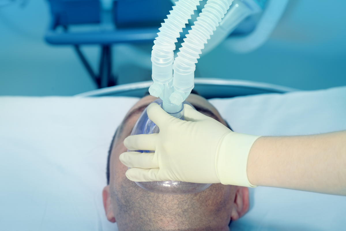 nurse holding airway mask