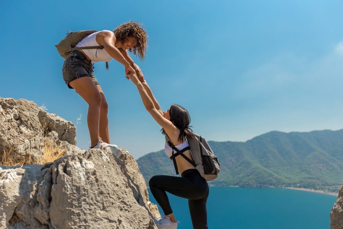 A helping hand offered to someone taking the next step