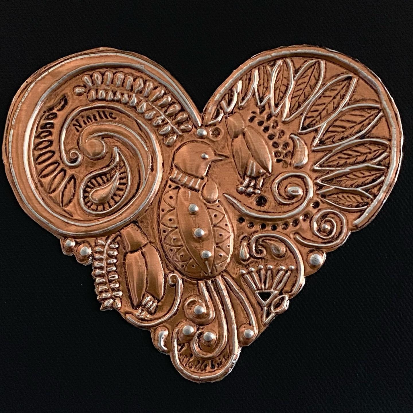 Heart-shaped copper bird art by Ninette Kruger