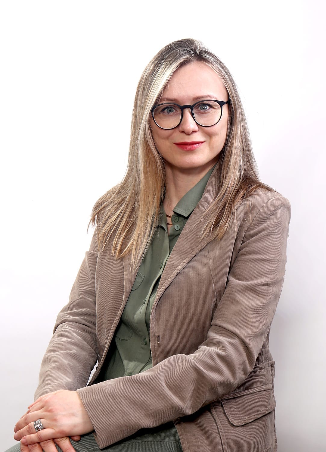 a young woman holding her neck in pain
