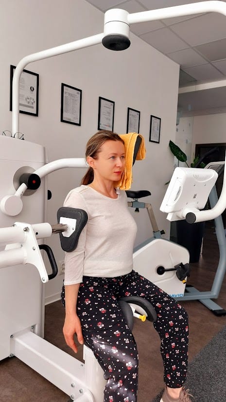 a woman exercising on gym equipment 