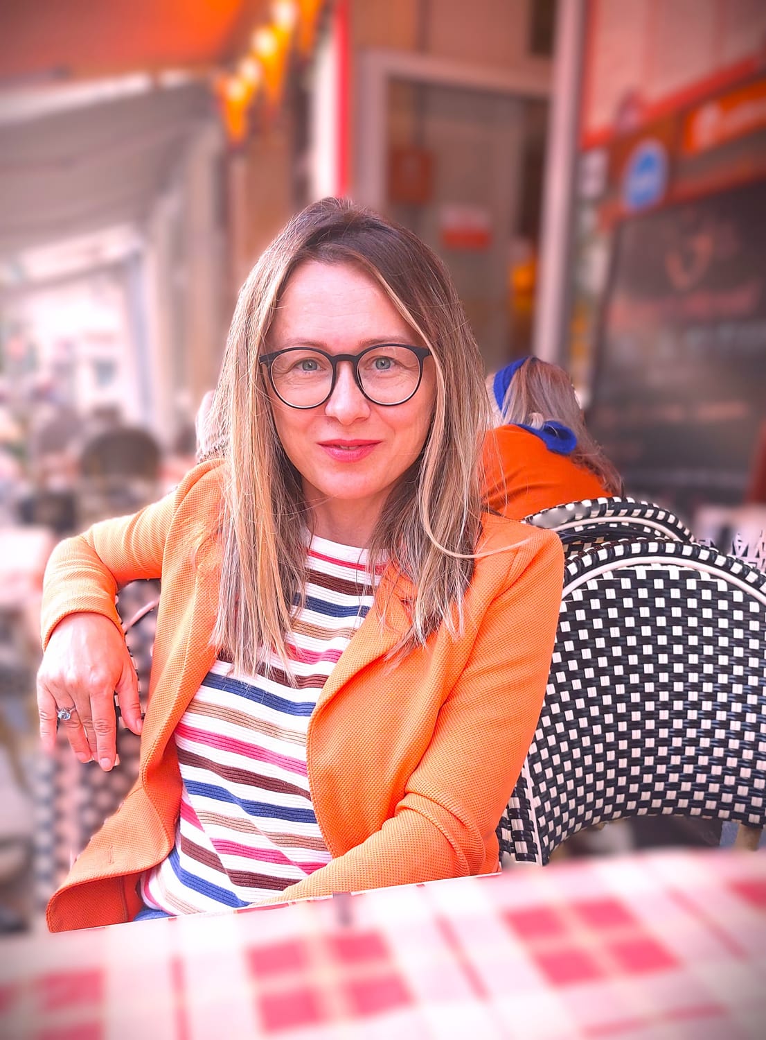 a young woman holding her neck in pain