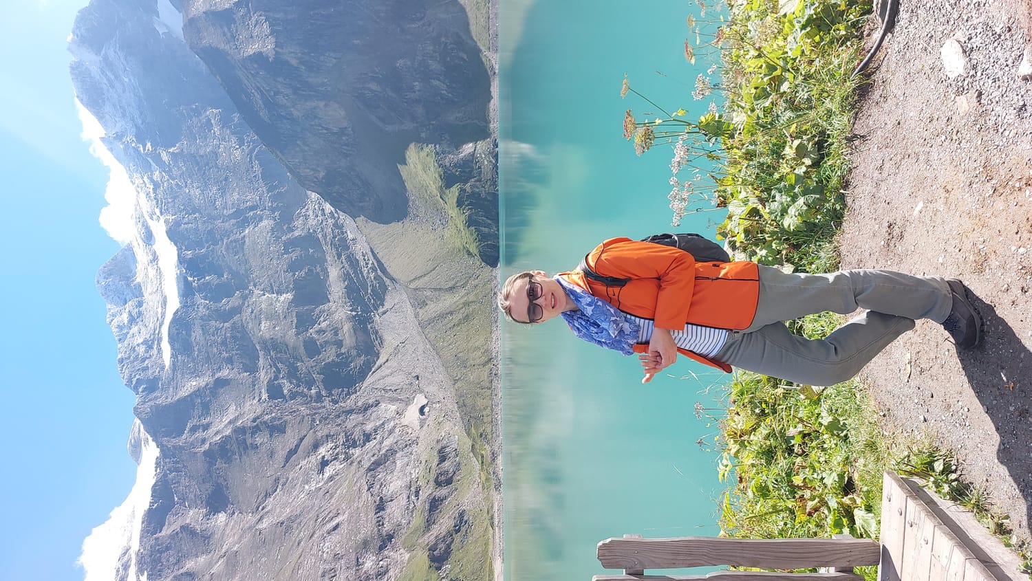 image of an artificial spine on the floor with 2 small green dumbells