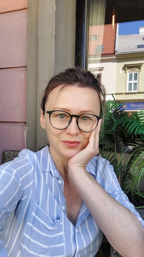 A WOMAN LOKING INTO A CAMERA