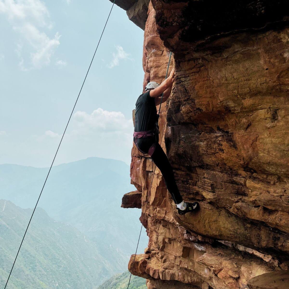 Man rock climbing in a canyon in Colombia