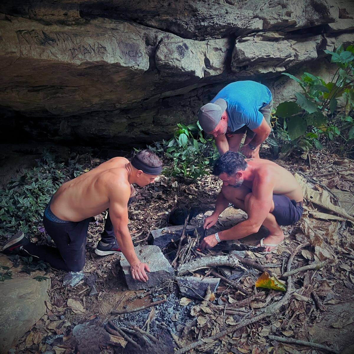 3 men making a fire