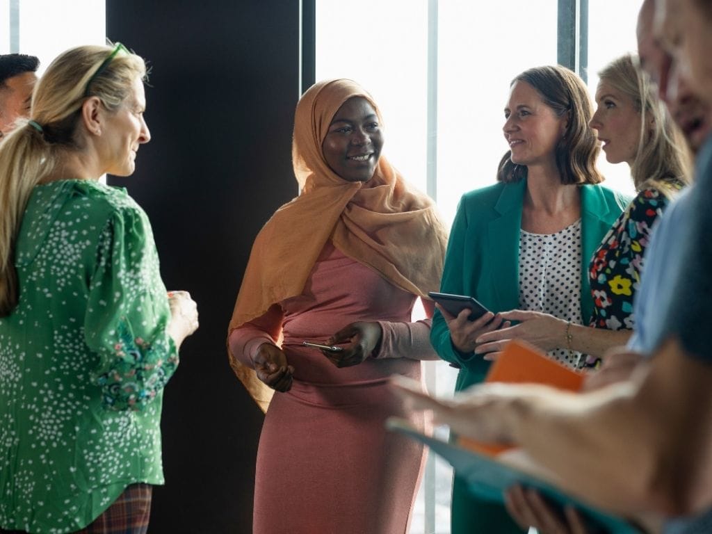 A group of women representing the communities served by Lead With Impact partner organisations, whose voices and stories are captured through the LEAD framework